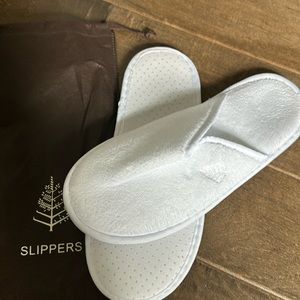 Men’s slippers.  From Four seasons hotel